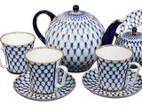 blue and white porcelain tea set with matching cups and saucers