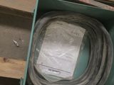 a box that has a hose in it on a pallet