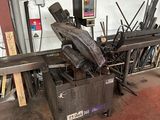 an image of a machine that is working on a piece of metal