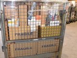 a metal cart with boxes on it in a warehouse