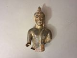 a small statue of a person on a white surface