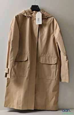 the coat is hanging on a hanger on the wall