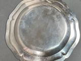 a silver plate sitting on top of a table