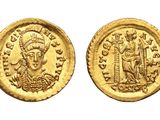 a gold coin with an image of a man on it