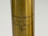 a close up of a brass cylinder with writing on it