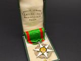 an image of a medal in a box with a ribbon around it