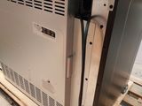 an image of a stainless steel oven sitting on a pallet