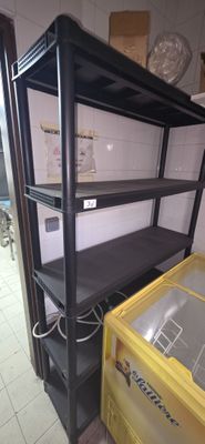 two shelves that are next to each other in a room