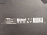 a close up of a laptop with a barcode on the back