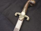 a knife that is laying on a black cloth