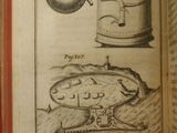 someone is holding an open book with a drawing of a teapot and a tea pot