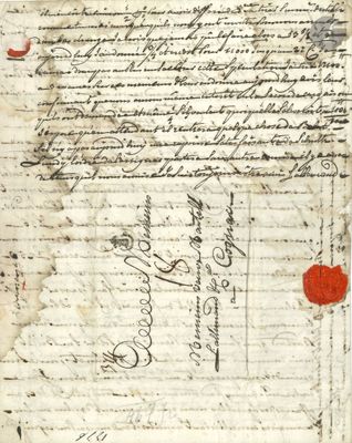 un vieux document sur lequel figurent des inscriptions et un cœur rouge