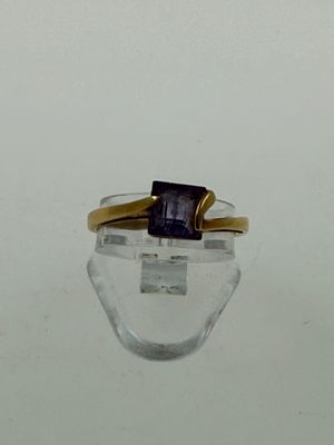 an image of a ring with a blue stone