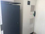a refrigerator and a refrigerator freezer in the corner of a room