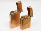 two lighters sitting next to each other on a white surface