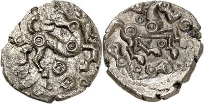 a silver coin with an image of a man on it