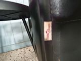 a sticker on the back of a black chair