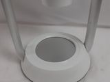 a white light that is on a white table