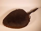an old brown leather purse with a handle and a handle