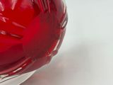 a glass bowl with a red liquid inside of it