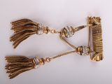pair of gold tone tassels with crystal accents on a white background