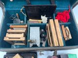 a suitcase filled with assorted items on a table