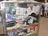 a metal cart filled with lots of stuff inside of a building