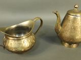 pair of antique silver plated teapots and creamer