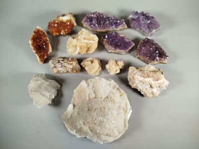 a lot of different colored rocks on the table