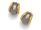a pair of black and gold earrings on a white background