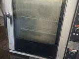 an image of a commercial oven sitting in a garage
