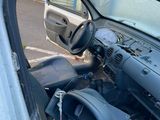 a car that has been left in the street with its door open