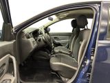 the interior of a car with the door open and the driver ' s seat down