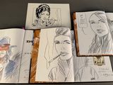 sketches of a man and a woman in a hat and a tie