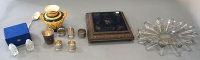 a lot of glass items on a table with a blue box