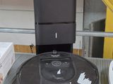 a robot that is sitting on a shelf next to a box