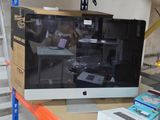 a computer monitor sitting on top of a table in a store