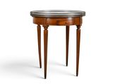 a round table with a marble top and wooden legs