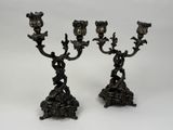 pair of antique bronze candlesticks with flowers and birds on them