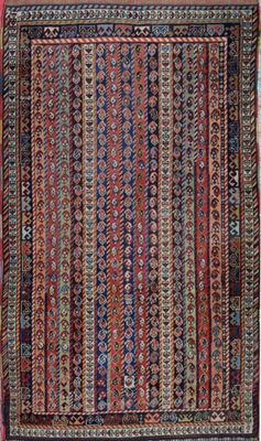 a red and blue rug with a pattern on it
