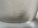 a close up of a white vase with writing on it