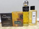 three bottles of perfume on a wicker table