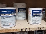 many cans of paint on a shelf in a room