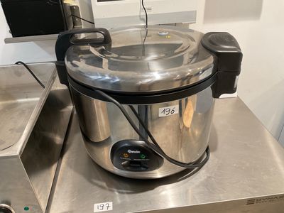 a stainless steel pot with a lid on top of a counter