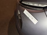 a close up of a car with a sticker on it ' s hood