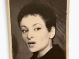 a black and white photo of a woman with short hair