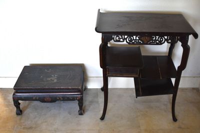 a small table and a small stool in a room