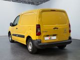 a yellow van that is parked in a room