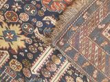 an image of a cat laying on top of a rug on the floor