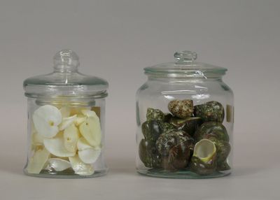 two glass jars with different types of food in them